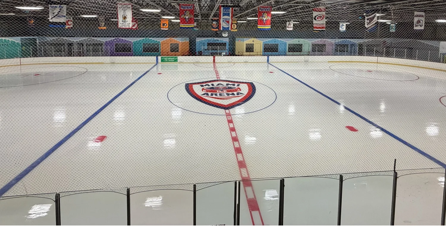 Center ice at Miami Ice Arena with the arena crest painted on the surface