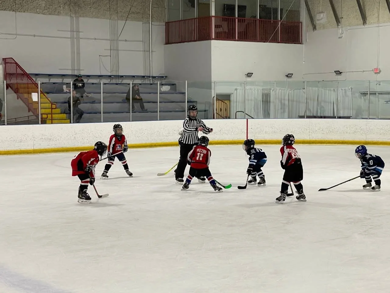 A busy game day inside Miami Ice Arena with players and spectators